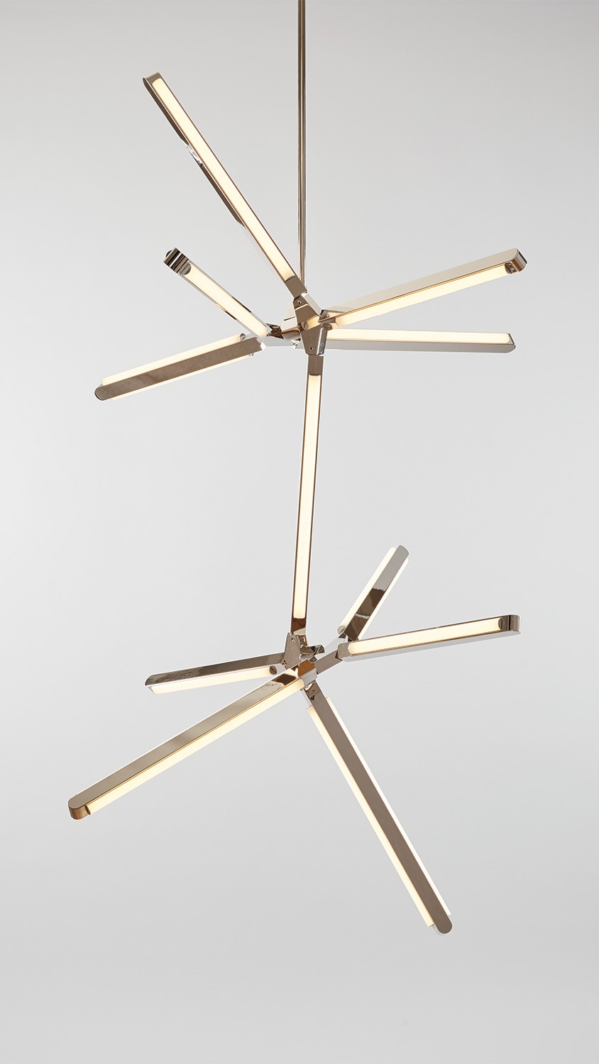 Front view of an illuminated Pris Crystalline fixture with reflective polished nickel metal components