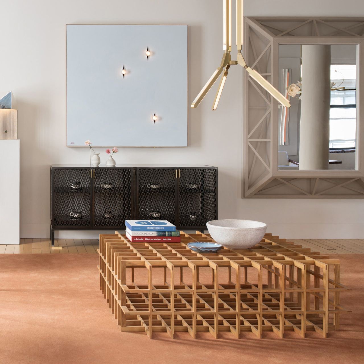 Pelle’s Incise 48x48 wall light, with three bulbs set in pale blue canvas shown with the Louise Sideboard and Quadrat Cuboid 47.