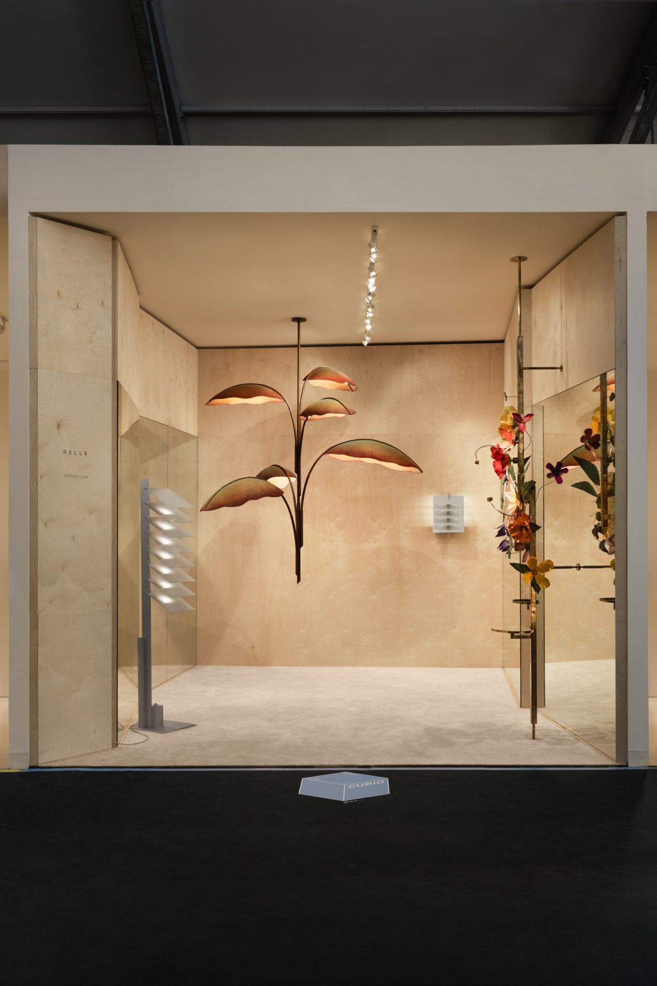 Pelle’s booth at Design Miami, featuring two opposed lighting collections, Lure and Be Patient.