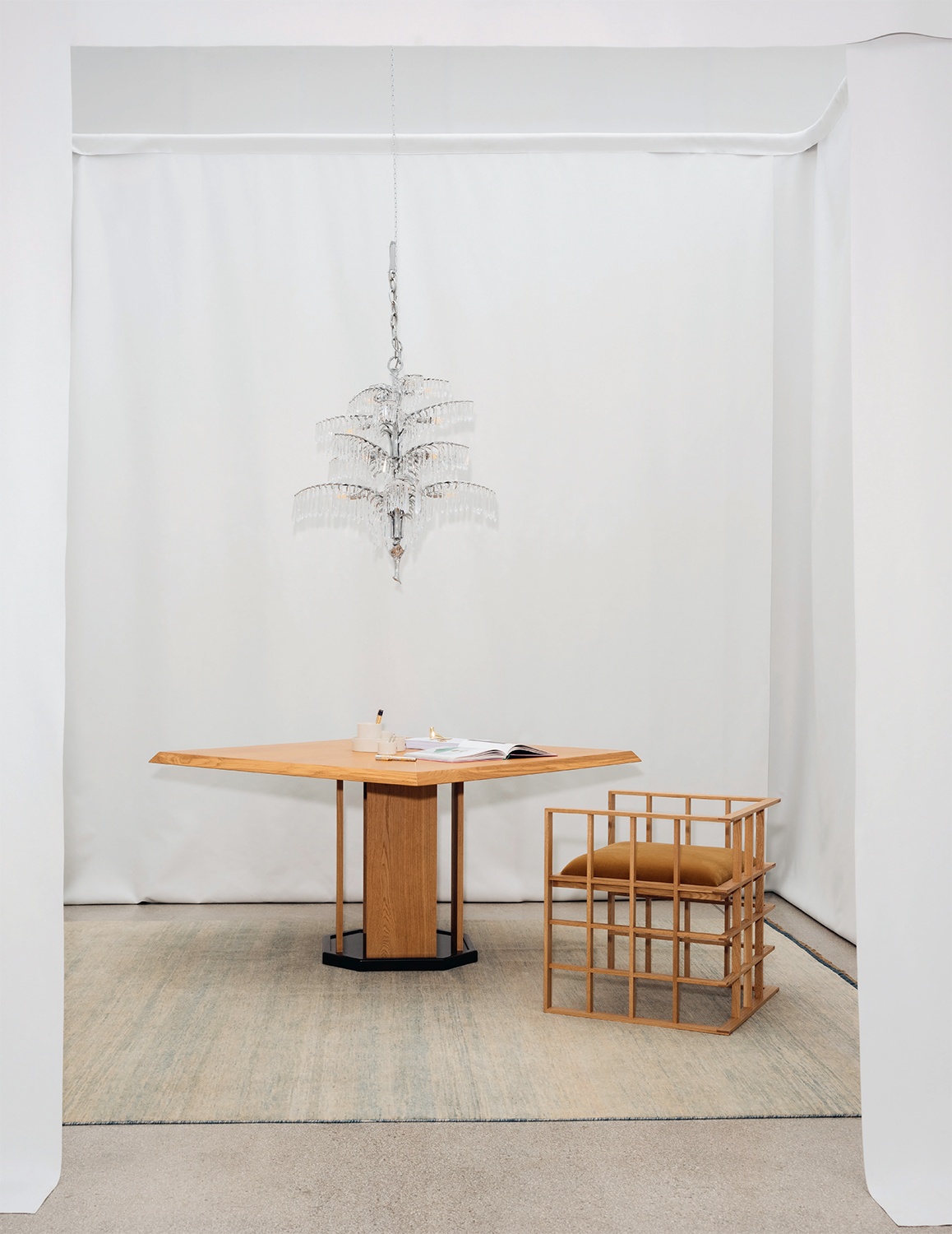 Josef Hoffman chandelier, Hauvette and Madani table, and Pelle Quadrat Armchair